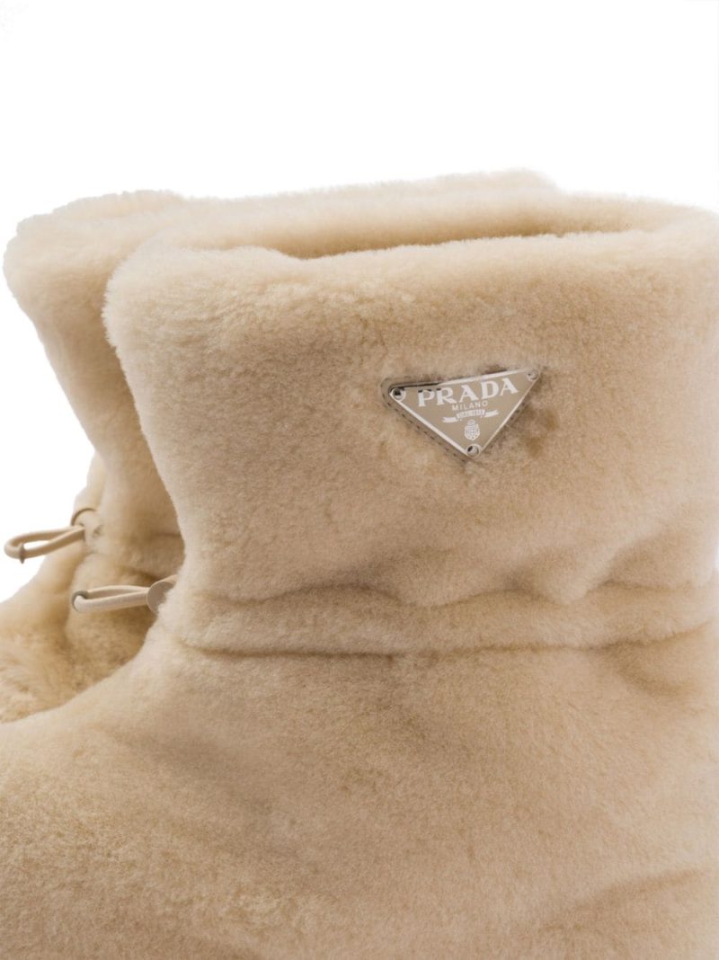 triangle-logo shearling boots